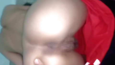 Indian wife wipes her hands while husband cleans the floor