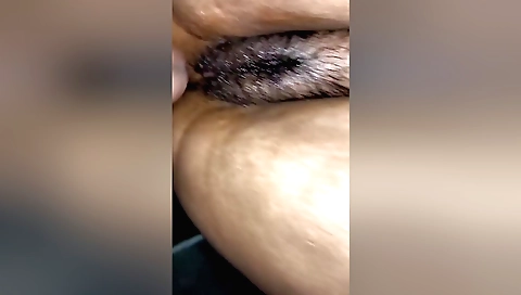 Indian teen fucks herself in the bed with a big dildo