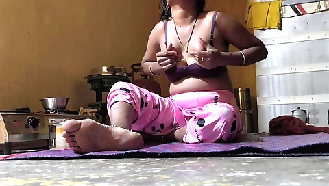 Indian woman with a cute face is eating her meatballs