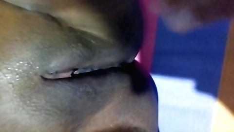 Amateur girl with a nice face is holding a stick in her mouth