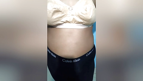 Mature brunette is wearing a sexy dress and is wearing it off