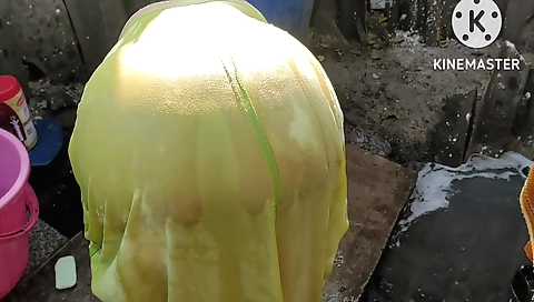 Busty brunette in a sexy dress outdoors doing something