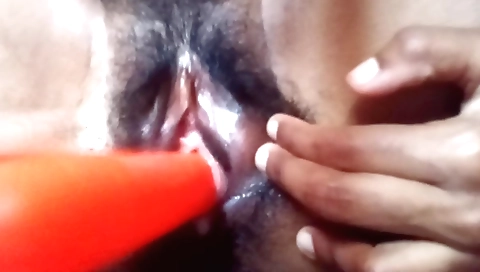 Asian brunette uses dildo to have fun in her hairy pussy