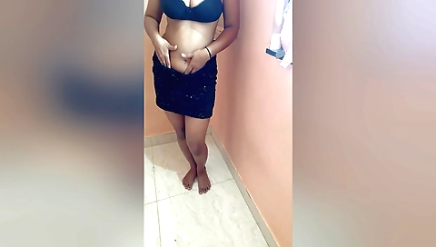 Indian brunette in a dress is dancing on the Bhojpuri song