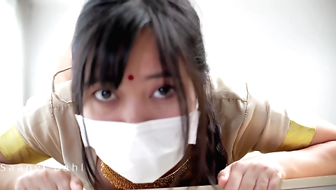 Big tittied brunette in a sexy dress and sexy pose