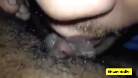 Hairy Indian milf is on the beach licking a hard cock