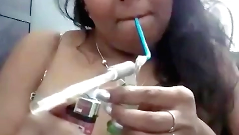 Bhabhi enjoys the hookah in the bedroom as she fucks it