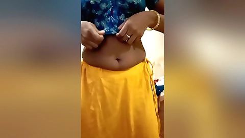 Indian stepmom with a pink bra and a sexy saree in a hotel room