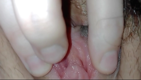 Sexy blonde with a hairy pussy gets naked and fingering