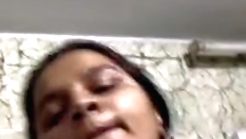 Brunette wife with big boobs is wearing a dress and webcam