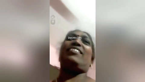 Mature brunette strips off and shows her juicy pussy