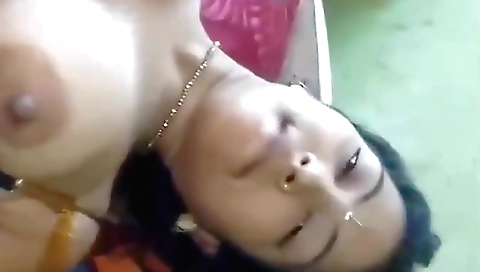 Busty indian brunette enjoys being alone on the bed