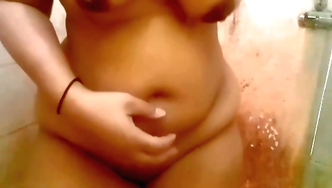 Indian chick with huge tits washing her face in the shower