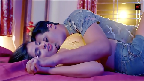 Brunette is painting her clothes with a paintbrush