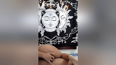 Busty brunette with a cute smile plays with her wet pussy