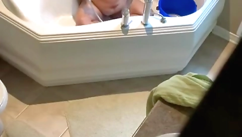 Busty brunette in a hidden camera shows off her boobs